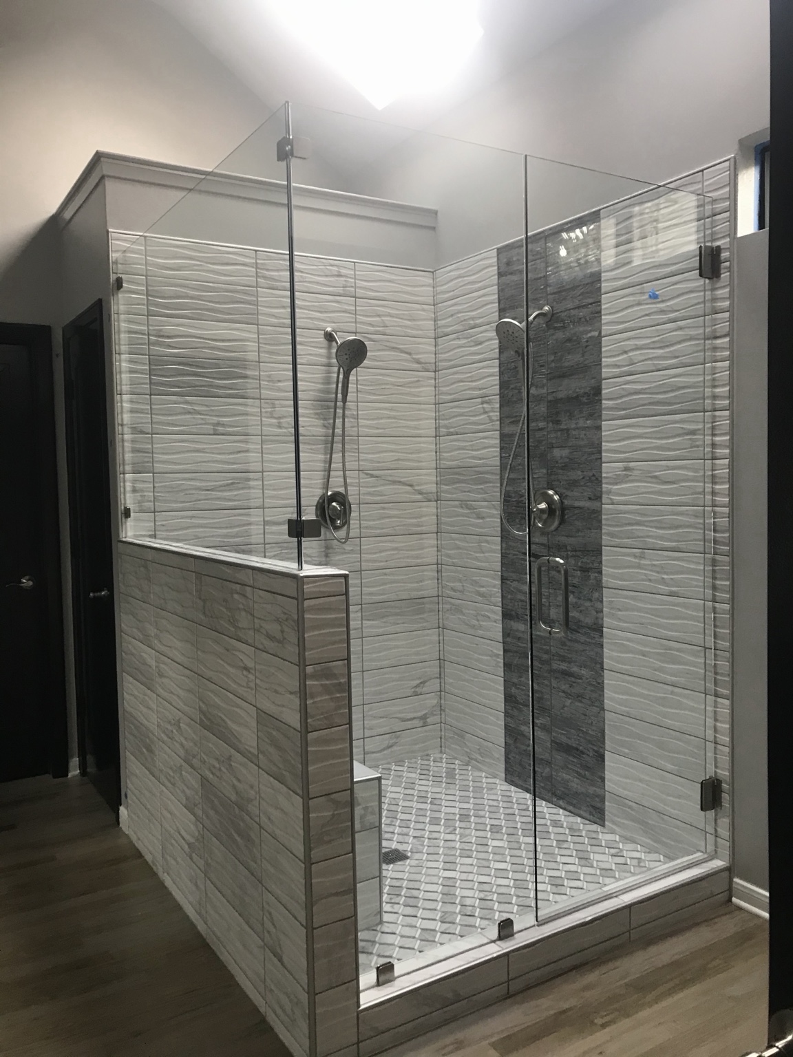 Large custom walk-in shower with glass enclosure